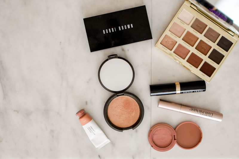 A soft morning vanity with a few simple makeup products laid out neatly